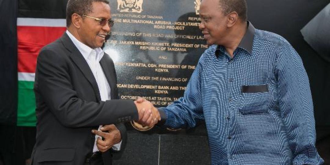 Kenyan president Uhuru Kenyatta (left) and Tanzania’s president Jakaya Kikwete jointly unveiled a commemorative plaque during the official launch of the Arusha-Holili/Taveta-Mwatate road.