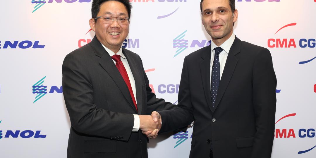 Rodolphe Saadé, vice-chairman of CMA CGM, and Ng Yat Chung, CEO of NOL, seal the deal with a handshake.