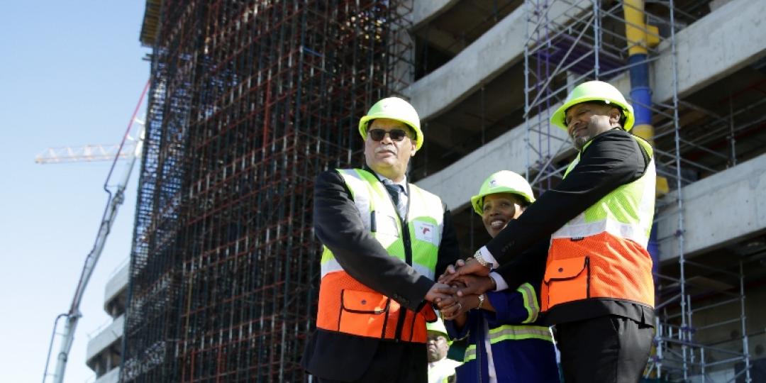 Nelson Mandela Bay mayor Danny Jordaan, Ngqura port manager Mpumi Dweba, and TNPA CE, Richard Vallihu, at the construction site of the port’s administration building.