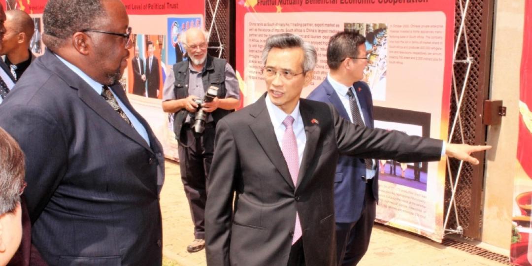 Chinese Ambassador to SA, Lin Songhtian (right), showing Minister of Public Works, Nkosinathi Nhleko, some of the displays showcased at the event.