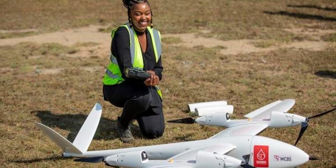 An official shows off the TRON Unmanned Aerial Vehicle (UAV)